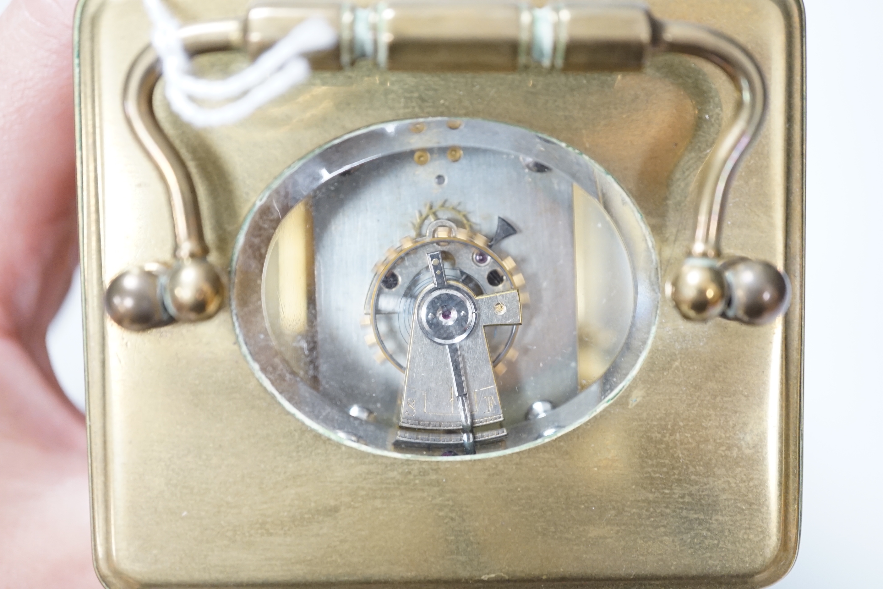 A French brass cased timepiece with silvered and enamelled dial, 12cm tall